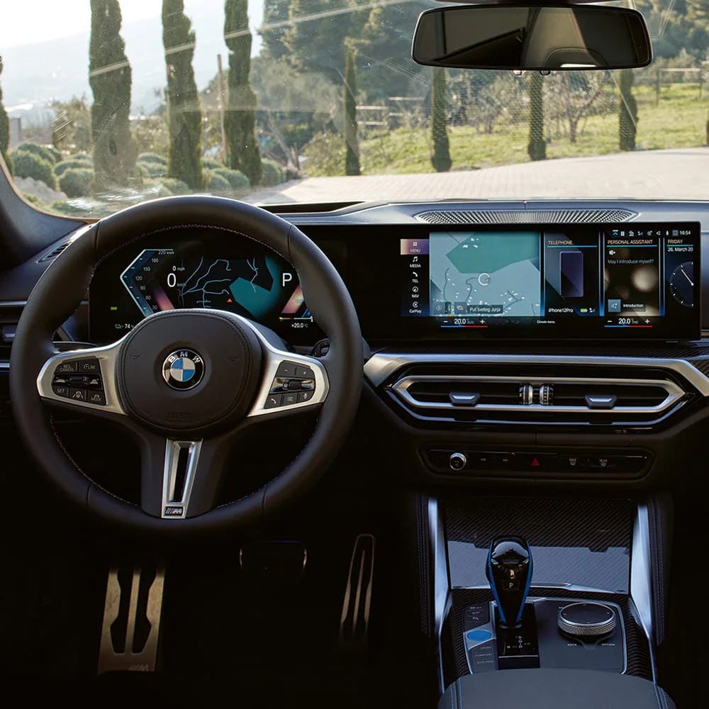 A driver's eye view of steering wheel and controls of the BMW i4 | Tom Bush BMW Orange Park in Jacksonville FL