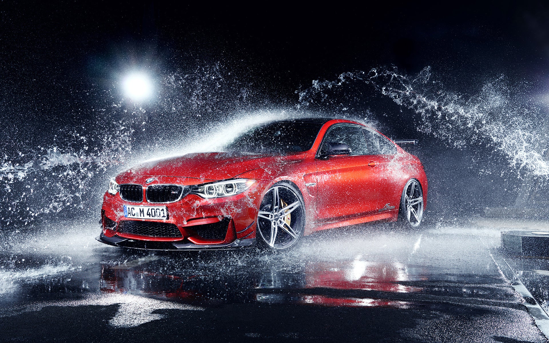 Red BMW sliding in water